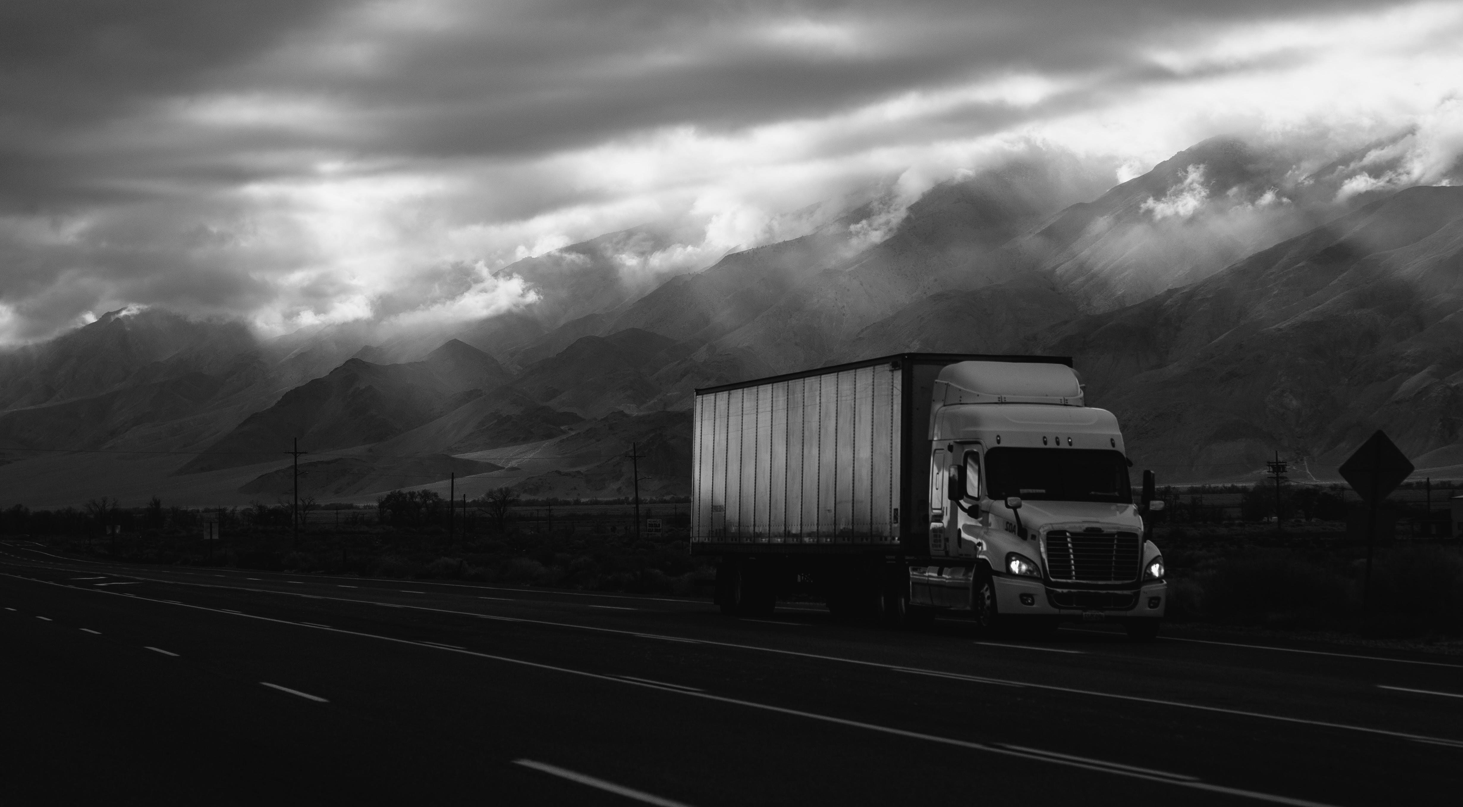 Logistics truck on highway (desktop)